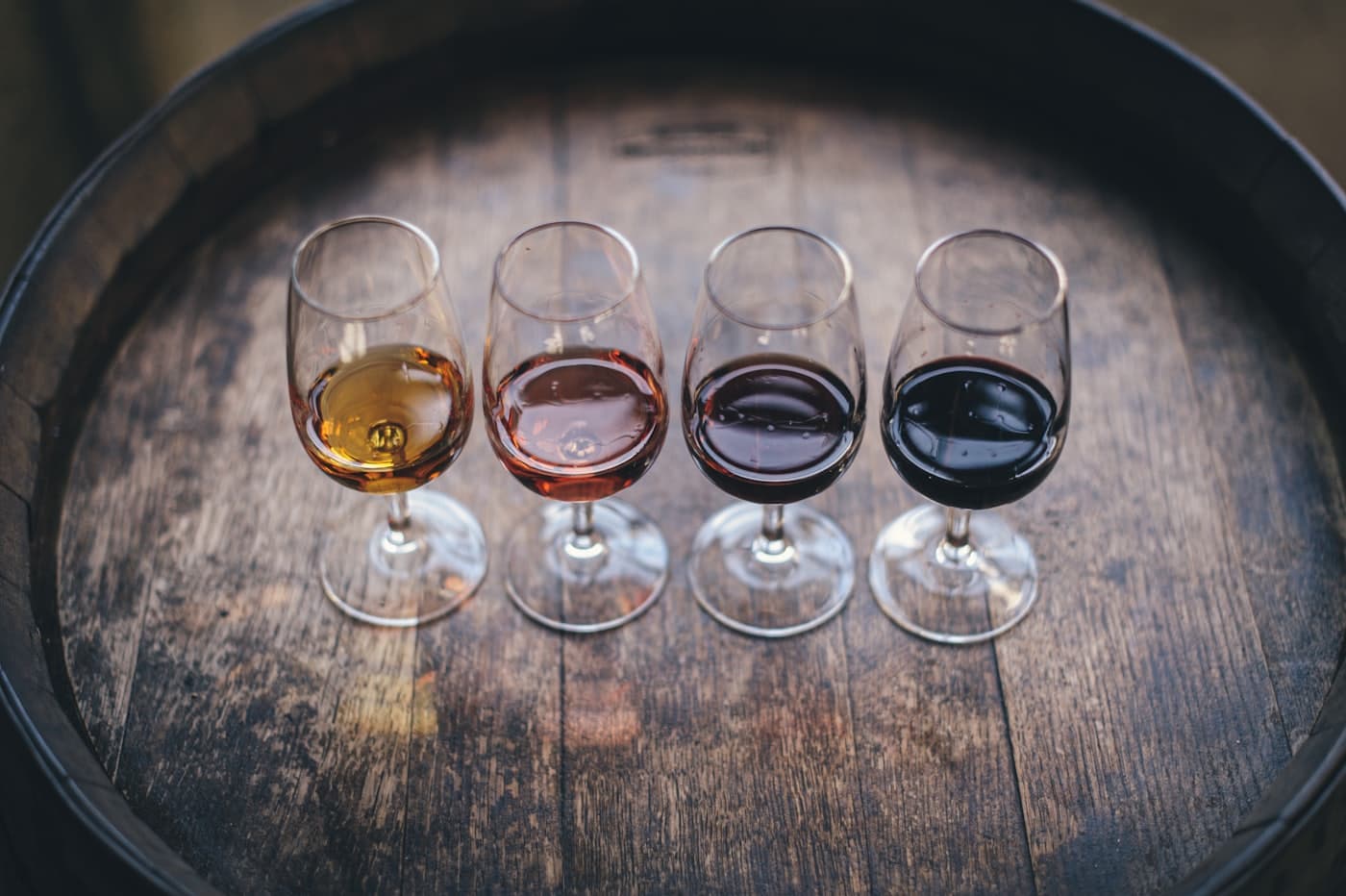 A glass of natural wine being poured